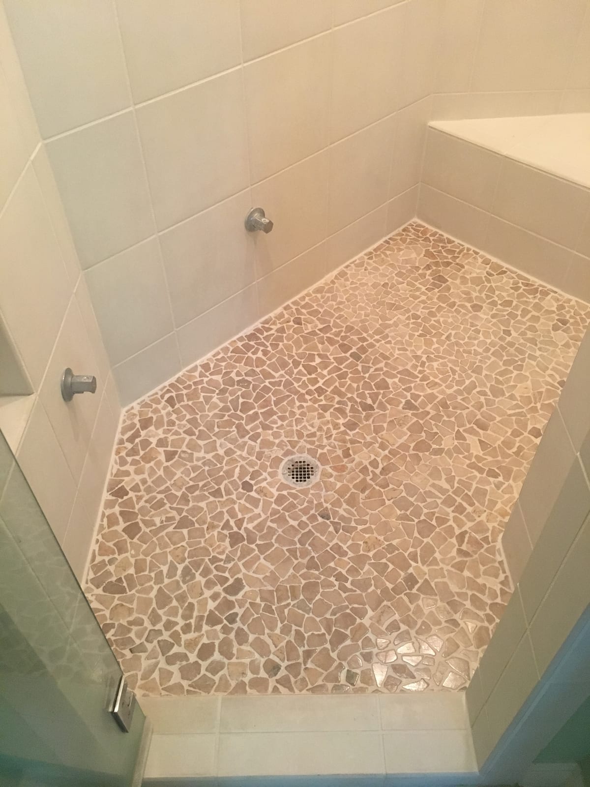 After: Pebble shower floor, cleaned and sealed