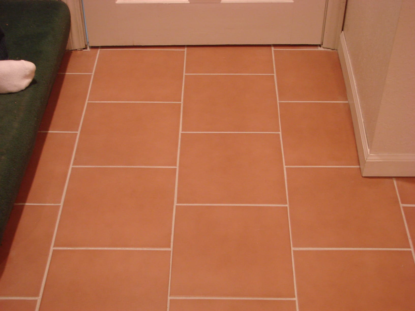 After: Entry tile, grout color sealed white
